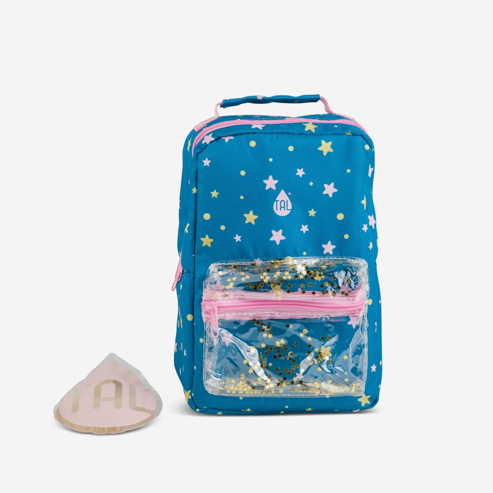 A blue insulated lunch bag with a star pattern, featuring pink straps, a front pocket with a clear window, and accompanied by a reusable ice pack.